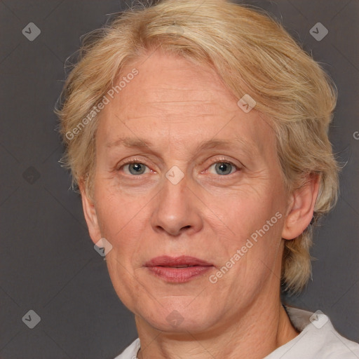 Joyful white middle-aged female with medium  brown hair and blue eyes