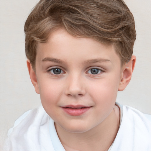 Joyful white child male with short  brown hair and grey eyes