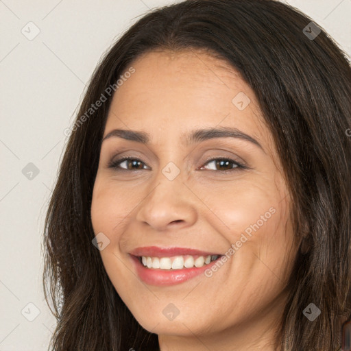 Joyful white young-adult female with long  brown hair and brown eyes