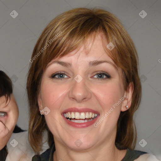 Joyful white young-adult female with medium  brown hair and blue eyes