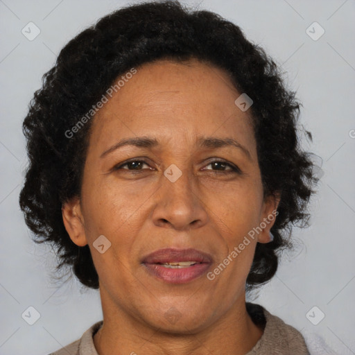 Joyful black adult female with short  brown hair and brown eyes