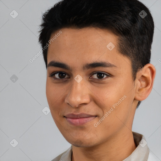 Joyful latino young-adult male with short  black hair and brown eyes