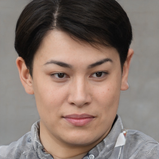 Joyful asian young-adult female with short  brown hair and brown eyes