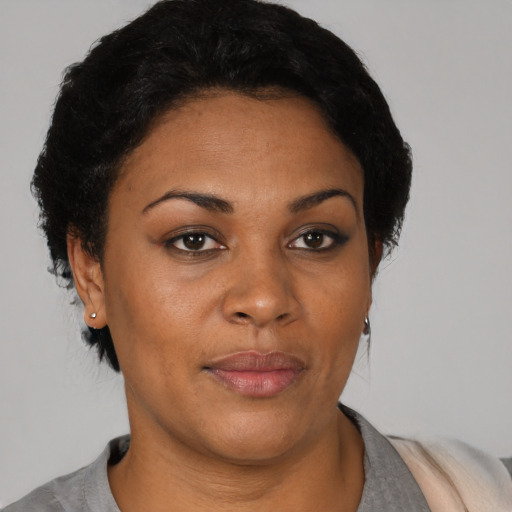 Neutral black young-adult female with short  black hair and brown eyes