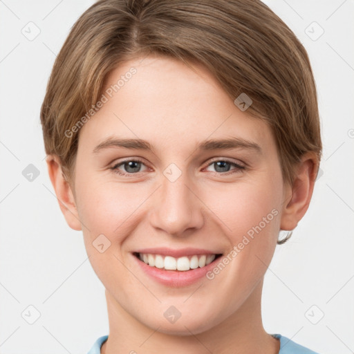 Joyful white young-adult female with short  brown hair and grey eyes