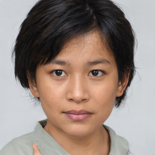 Neutral asian young-adult female with medium  brown hair and brown eyes