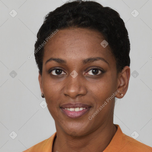 Joyful black young-adult female with short  black hair and brown eyes