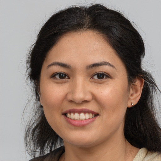 Joyful asian young-adult female with medium  brown hair and brown eyes