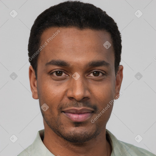 Joyful black young-adult male with short  black hair and brown eyes