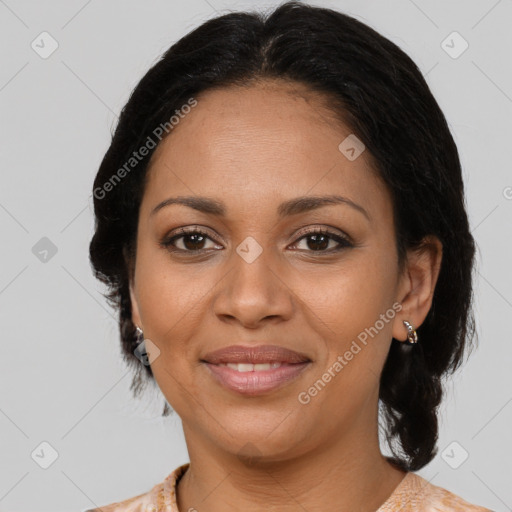 Joyful black adult female with medium  brown hair and brown eyes