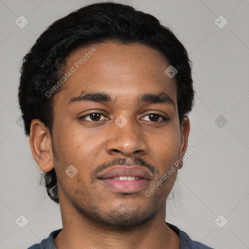 Joyful black young-adult male with short  black hair and brown eyes