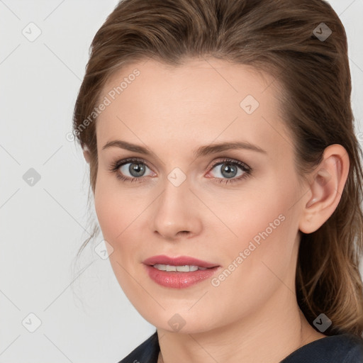 Joyful white young-adult female with long  brown hair and blue eyes