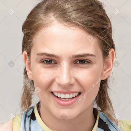 Joyful white young-adult female with medium  brown hair and blue eyes