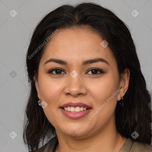 Joyful latino young-adult female with medium  brown hair and brown eyes