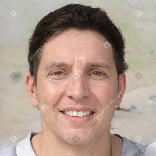 Joyful white adult male with short  brown hair and grey eyes