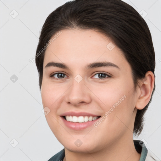 Joyful white young-adult female with medium  brown hair and brown eyes