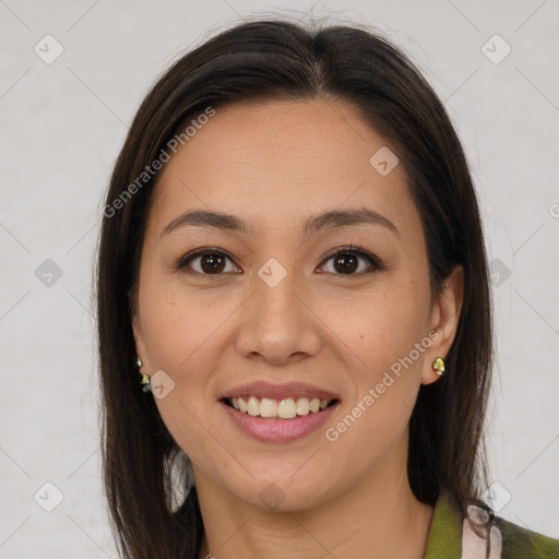 Joyful latino young-adult female with medium  brown hair and brown eyes