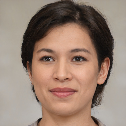 Joyful white young-adult female with medium  brown hair and brown eyes