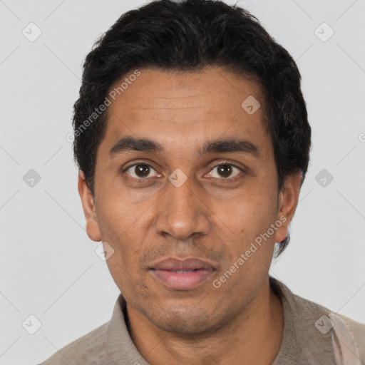 Neutral latino adult male with short  black hair and brown eyes