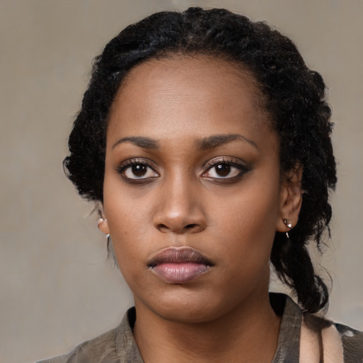Neutral black young-adult female with medium  black hair and brown eyes