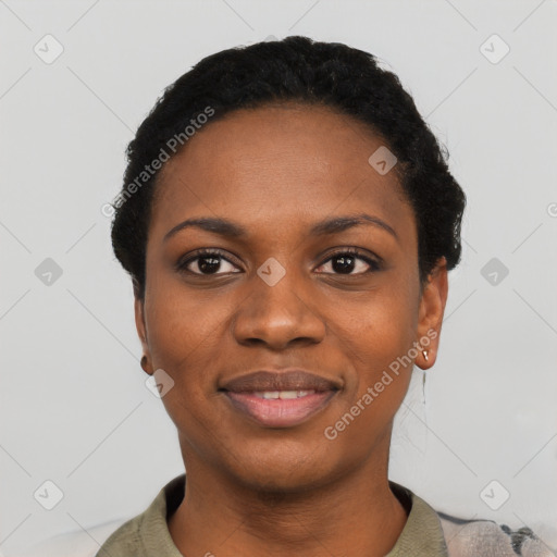 Joyful black young-adult female with short  black hair and brown eyes