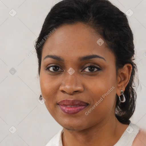 Joyful black young-adult female with medium  brown hair and brown eyes