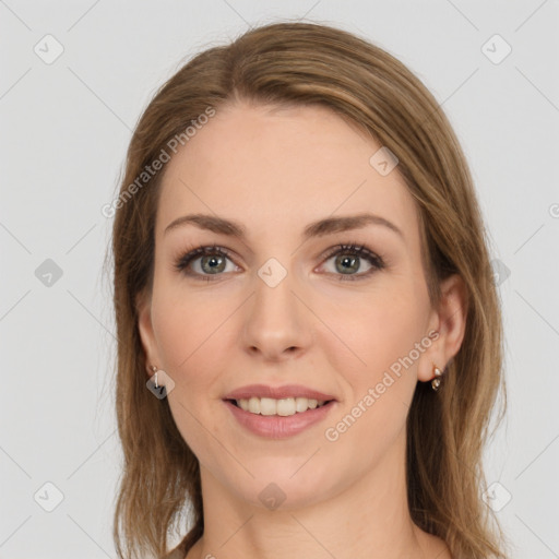 Joyful white young-adult female with long  brown hair and green eyes