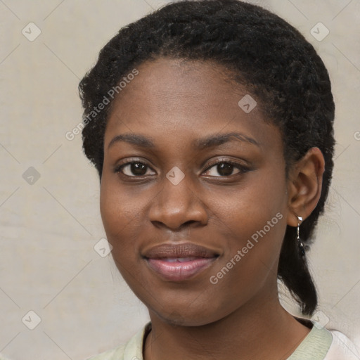 Joyful black young-adult female with medium  black hair and brown eyes