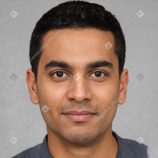 Joyful latino young-adult male with short  black hair and brown eyes