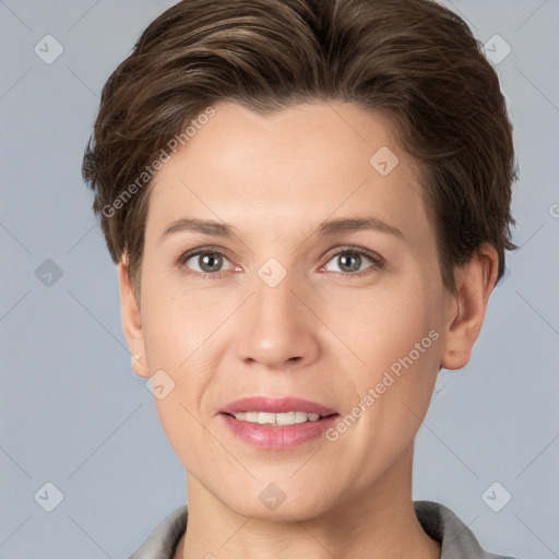 Joyful white young-adult female with short  brown hair and grey eyes