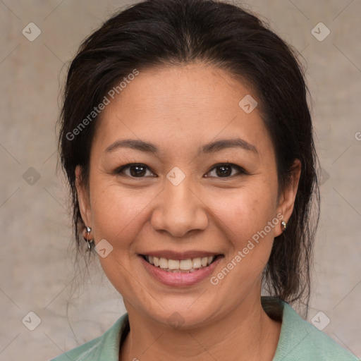 Joyful white adult female with medium  brown hair and brown eyes