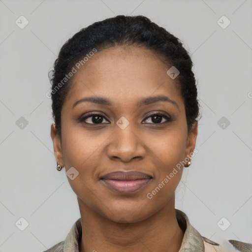 Joyful black young-adult female with short  black hair and brown eyes