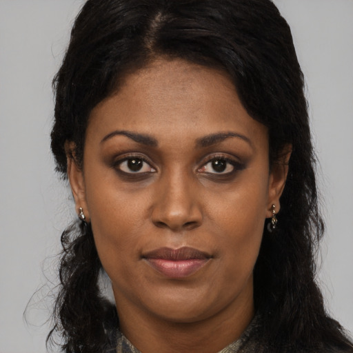 Neutral black young-adult female with long  brown hair and brown eyes