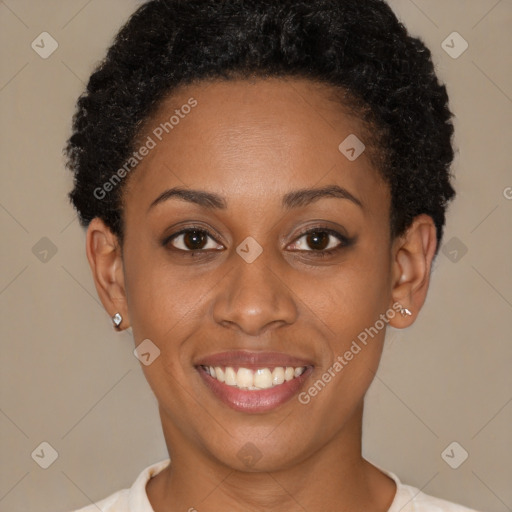 Joyful black young-adult female with short  brown hair and brown eyes