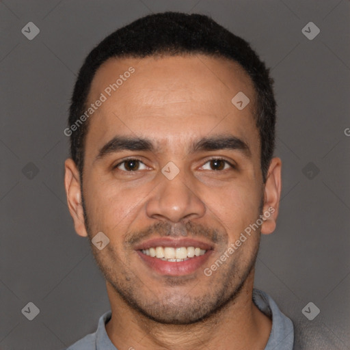 Joyful latino young-adult male with short  black hair and brown eyes