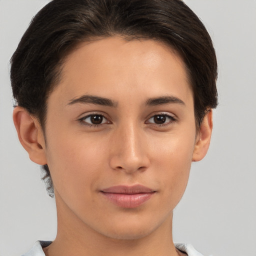 Joyful white young-adult female with short  brown hair and brown eyes