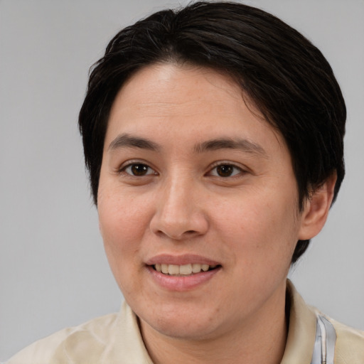 Joyful white adult female with medium  brown hair and brown eyes