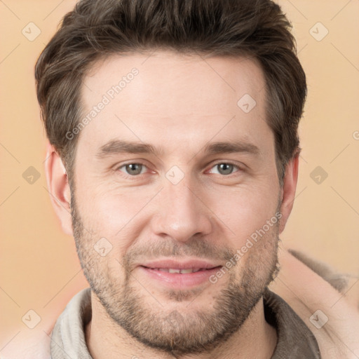 Joyful white adult male with short  brown hair and brown eyes