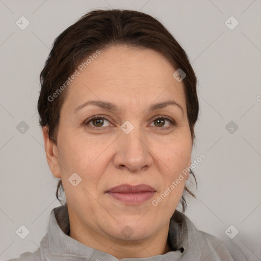 Joyful white adult female with short  brown hair and brown eyes