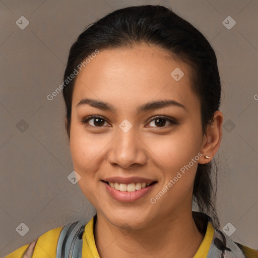 Joyful latino young-adult female with short  brown hair and brown eyes