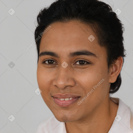 Joyful latino young-adult female with short  black hair and brown eyes