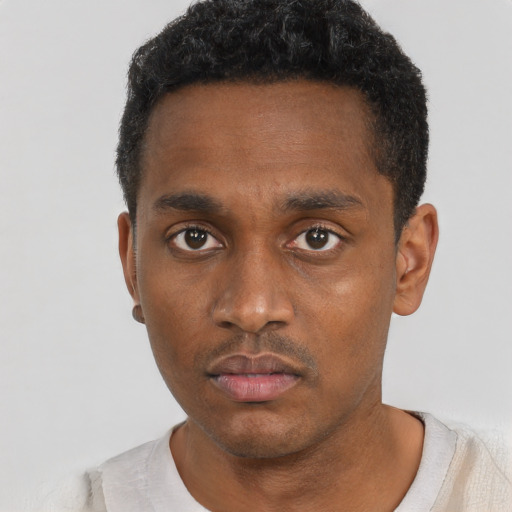 Neutral black young-adult male with short  black hair and brown eyes