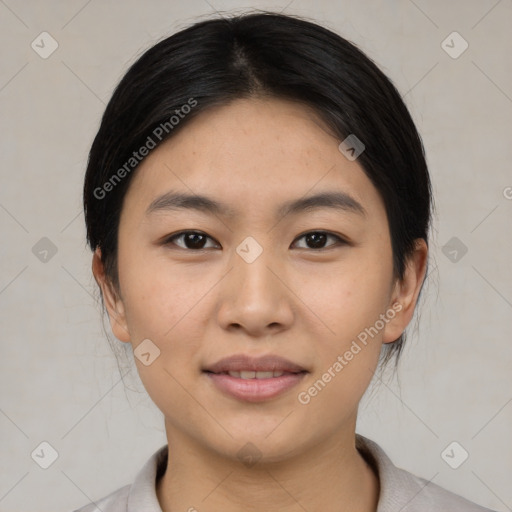 Joyful asian young-adult female with medium  black hair and brown eyes