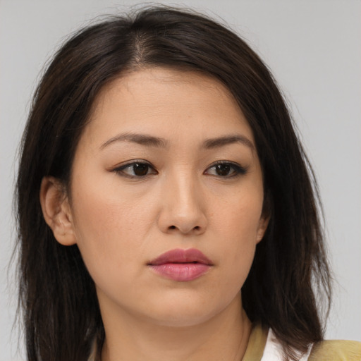 Neutral asian young-adult female with medium  brown hair and brown eyes