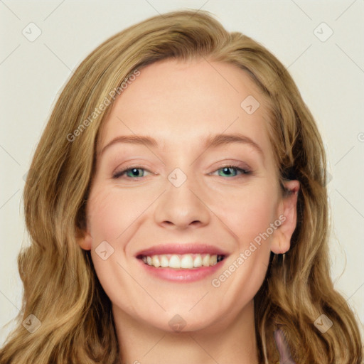 Joyful white young-adult female with long  brown hair and green eyes