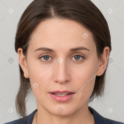 Joyful white young-adult female with medium  brown hair and grey eyes