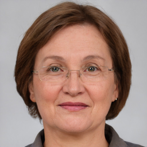 Joyful white middle-aged female with medium  brown hair and blue eyes