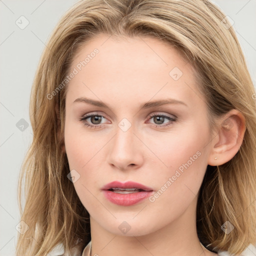 Joyful white young-adult female with long  brown hair and blue eyes