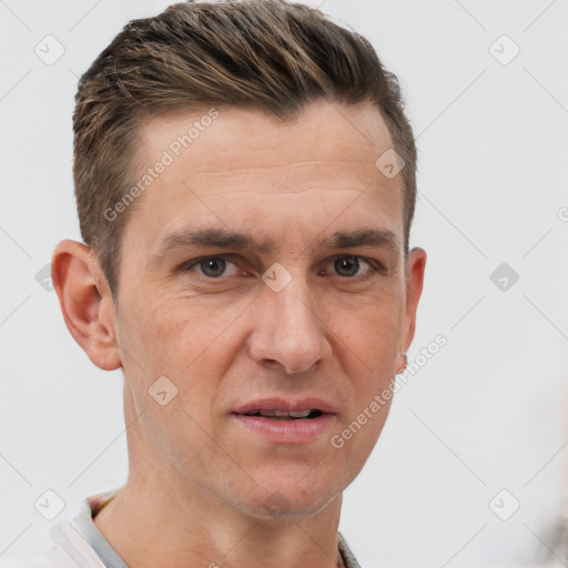 Joyful white adult male with short  brown hair and brown eyes