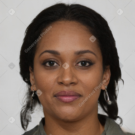 Joyful black adult female with medium  brown hair and brown eyes